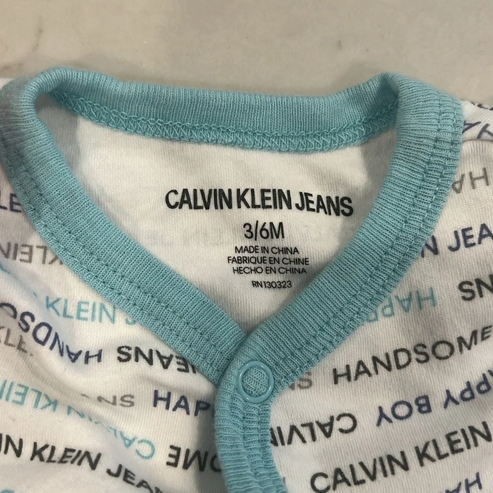 Calvin Klein Jeans baby footed coverall, never worn, size 3/6 months.